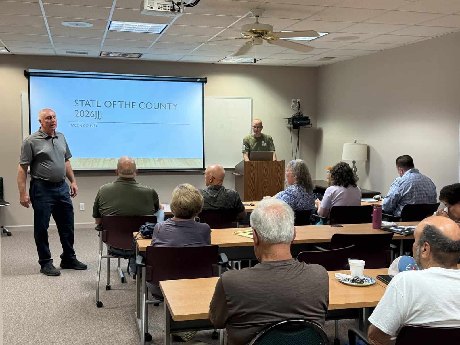 Community meeting with speaker presenting on county state of the union.