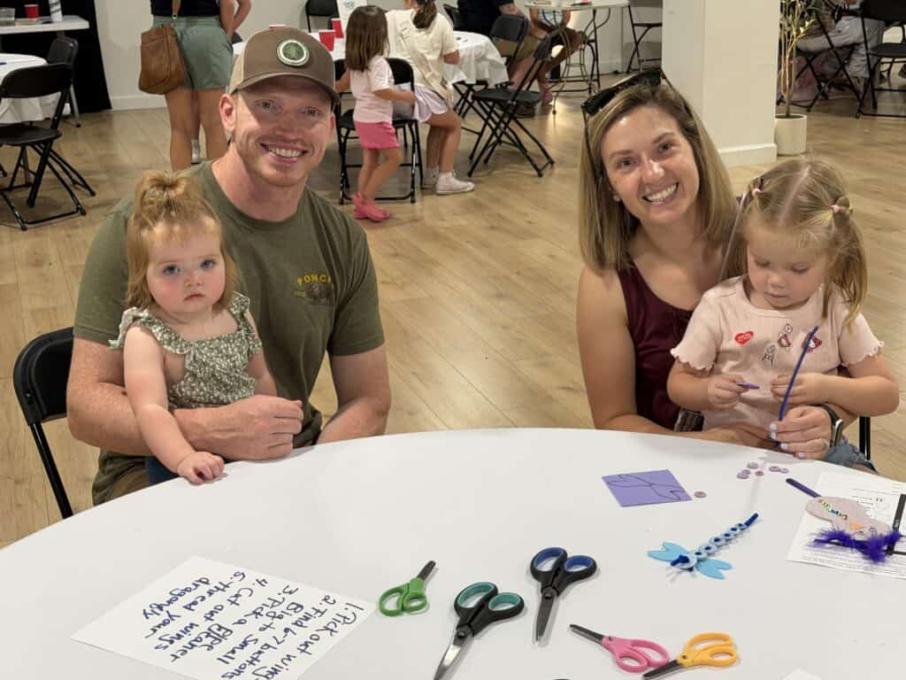 Family at ARTFEST in downtown Macon with children and art activities.