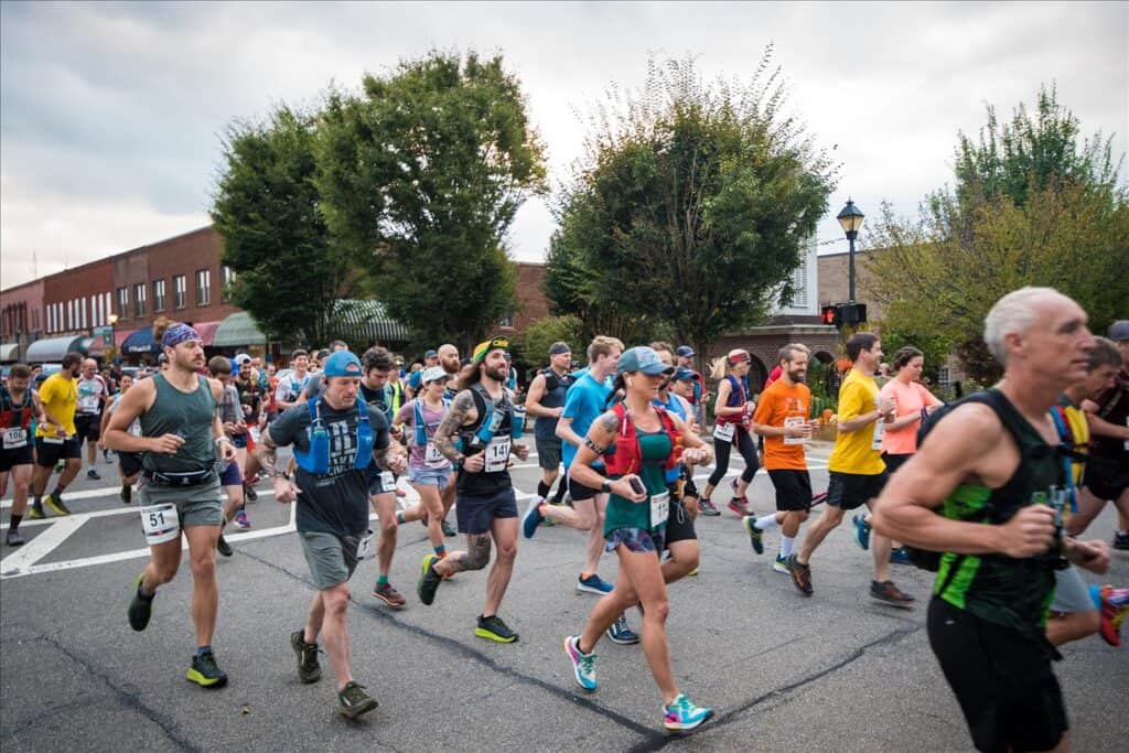 Marathon runners participating in a race in Macon, Georgia during fall.