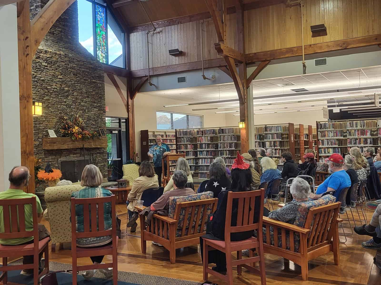 Community event at Macon County Public Library with audience listening to speaker.