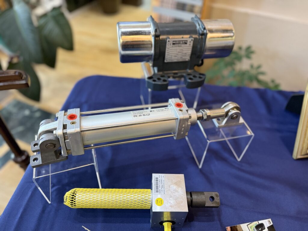 Industrial pneumatic cylinders and motor on display at Macon Sense.