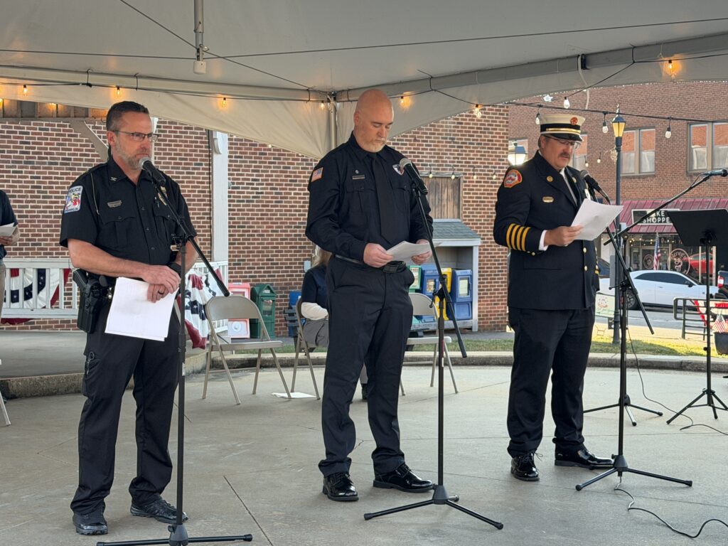 Fire and police officials reading at 9/11 memorial event in Macon.