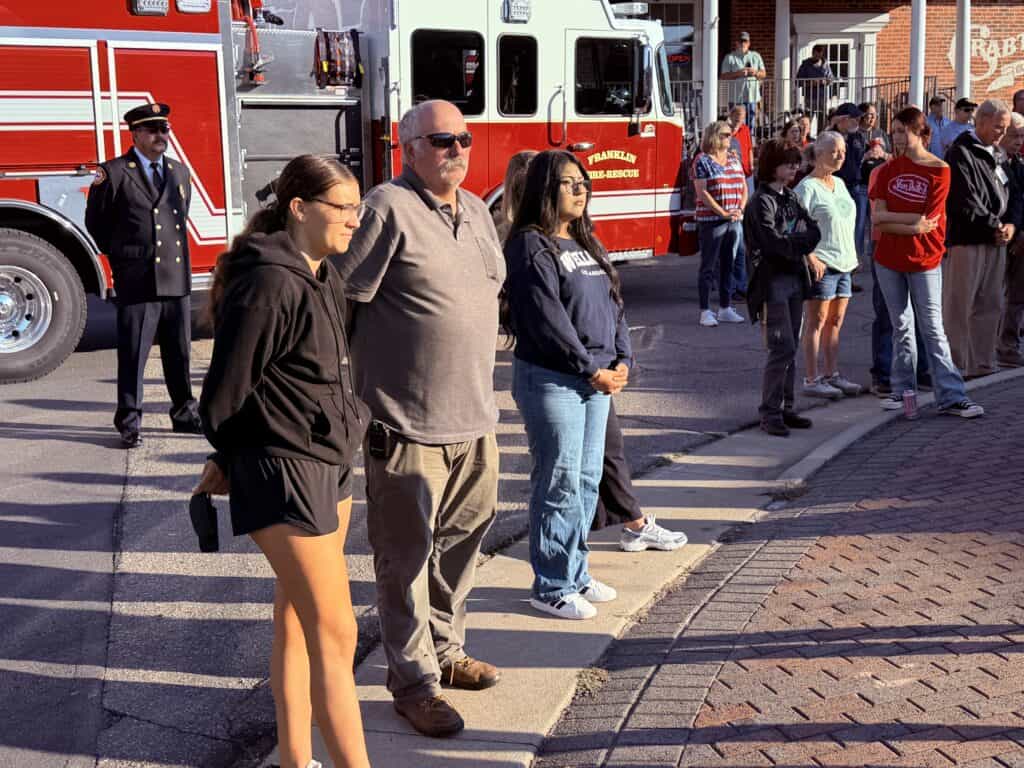 People gathered at a fire truck during a community safety event.