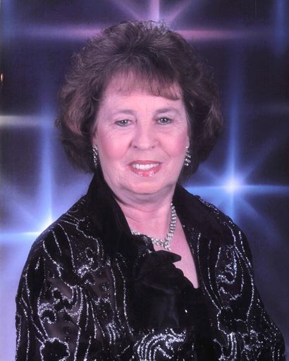 Portrait of Ruby Mae Collins in elegant attire with a starry background.