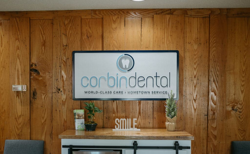 Corbin Dental sign on wooden wall in a dental office.