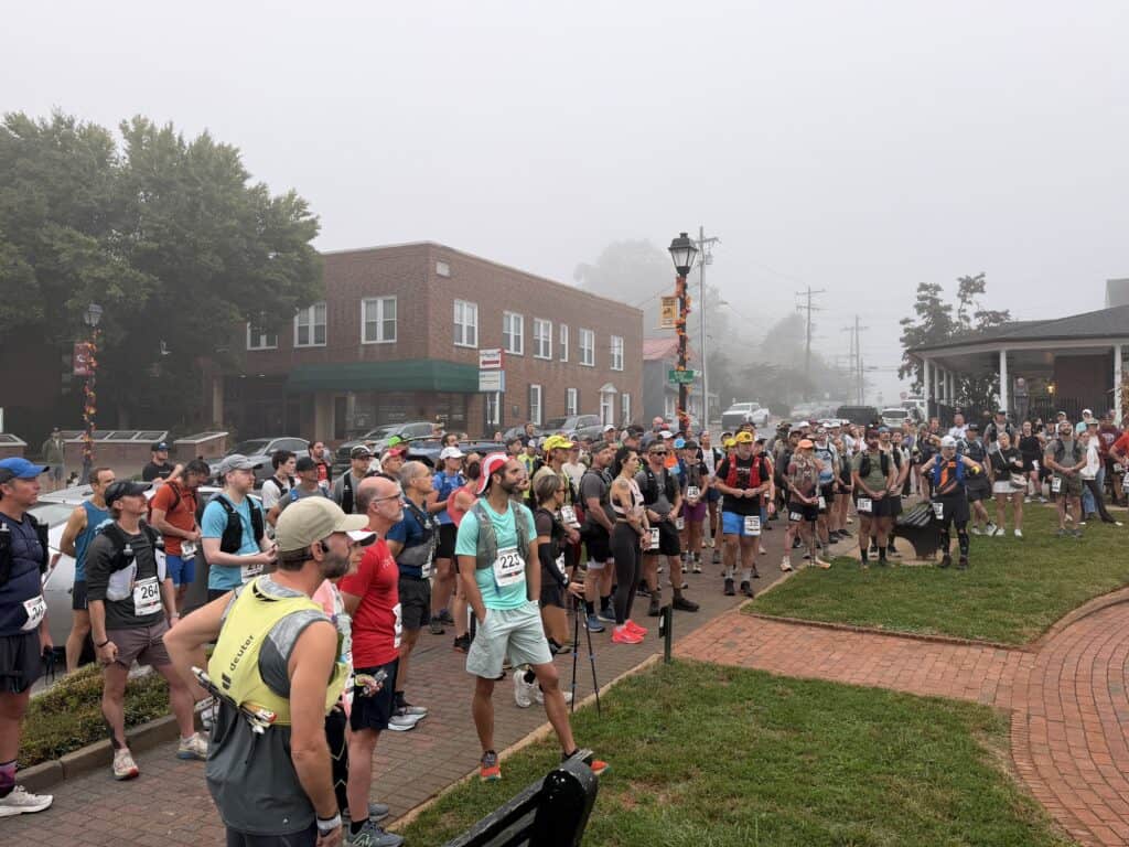 Crowd of runners at the start of a race in Franklin on a foggy day.