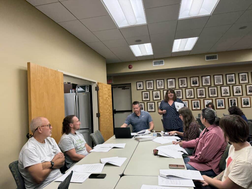 Group of people attending Franklin TDA meeting in a conference room.