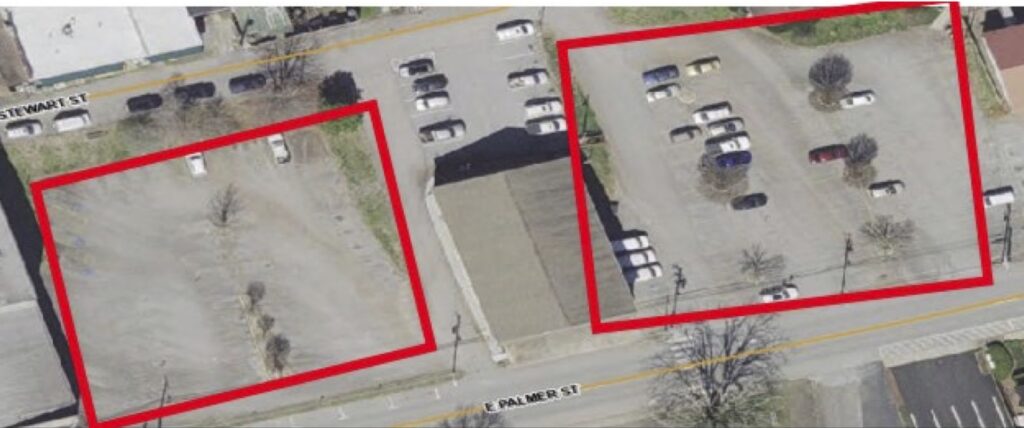 Aerial view of two parking lots marked for repaving in Macon, Georgia.