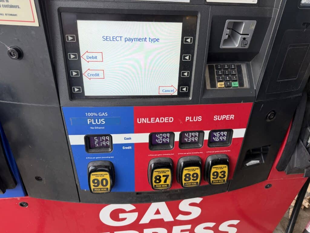 Gas pump payment terminal showing options for debit and credit card payments.
